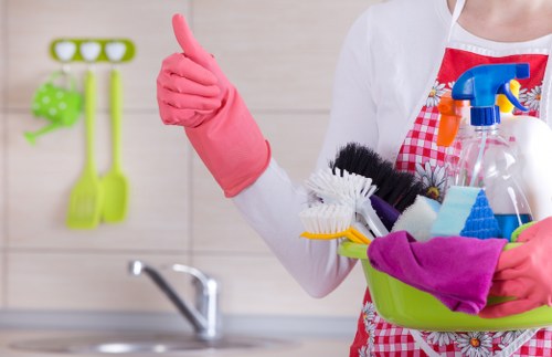 Supervisor reviewing workplace safety measures during cleaning